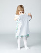 Zdjęcie: Girl choosing dress for herself Girl choosing dress for herself