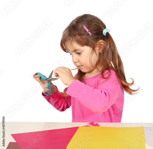 Photo: Little Child Girl Making a Cutout Little Child Girl Making a Cutout
