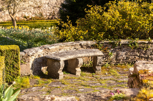 Photo: Old stone carved bench in garden Old stone carved bench in garden