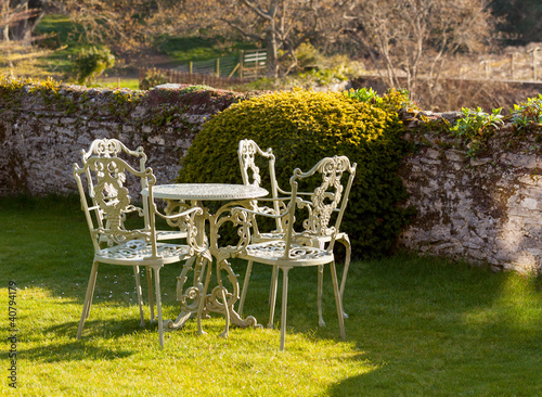Photo: Garden table and chairs on lawn Garden table and chairs on lawn