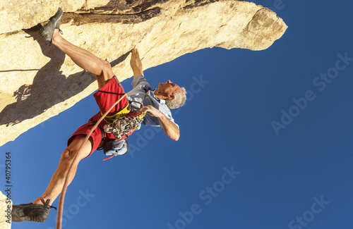 Photo: Middle aged male rock climber. Middle aged male rock climber.