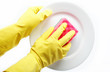 Hands in rubber gloves can sponge the plate on a white backgroun
