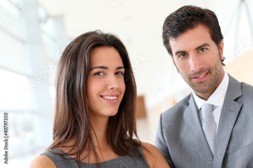 Photo: Portrait of business partners looking at camera Portrait of business partners looking at camera