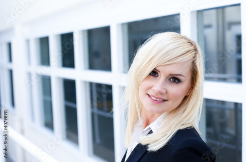 Photo: Attractive blonde woman with window Attractive blonde woman with window