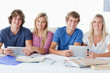 A smiling group of students looking at the camera