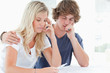 A worried couple holding a pregnancy test