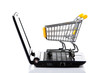 Shopping cart with notebook on the white.