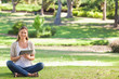 Woman in the park using her tablet computer