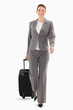 canvas print picture - Businesswoman walking forward with a suitcase