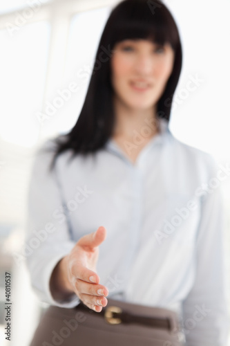 Photo: Focus on the hand of the woman offering a handshake Focus on the hand of the woman offering a handshake