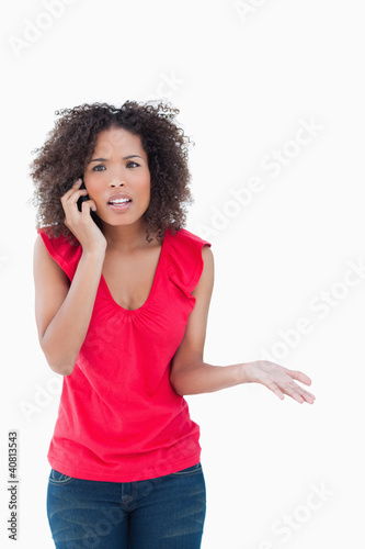 Photo: Serious young brunette wondering what happened Serious young brunette wondering what happened