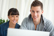 Portrait of two smiling students working together