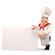 Smiling chef pointing towards sign