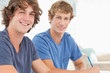 canvas print picture - Two male students looking into the camera and smiling