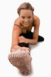 Foot of woman stretching on the floor Foot of woman stretching on the floor