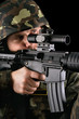 Armed soldier taking aim
