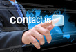 businessman hand pushing contact us button