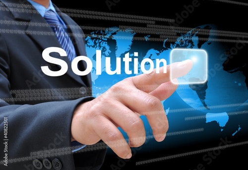 Photo: businessman hand pushing solution button businessman hand pushing solution button