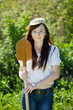 Happy woman gardening with spade Happy woman gardening with spade