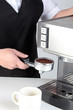Photo: Barista using an espresso machine. Barista using an espresso machine.