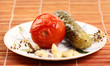 marinated tomato and cucumber on a plate marinated tomato and cucumber on a plate