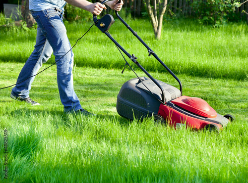 Photo: Man with lawnmower Man with lawnmower