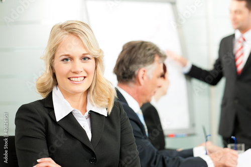 Photo: Business people - presentation within a team Business people - presentation within a team