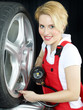 Apprentice learns to check air pressure of a summer tire