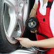 Close up of checking tire pressure