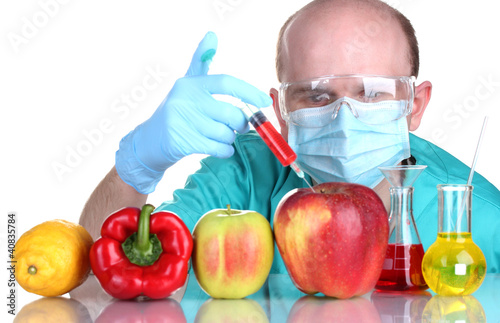 Photo: Scientist injecting GMO into the vegetables Scientist injecting GMO into the vegetables