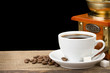 cup of coffee and beans isolated on black
