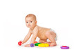 Small child play with toys on white background