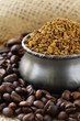 Fresh aromatic coffee beans in a metal red coffee box