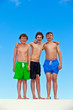 three  friends in swimmware stick together
