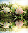 Photo: Colorful Easter eggs decorated with flowers in the grass Colorful Easter eggs decorated with flowers in the grass