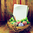Photo: Easter eggs in hay nest Easter eggs in hay nest