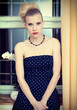 Attractive retro woman in old house