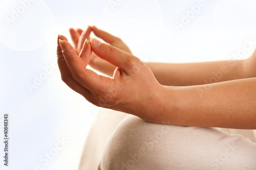 Photo: exercising yoga - detail of hand exercising yoga - detail of hand
