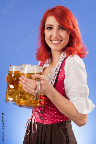 Photo: Oktoberfest waitress holding beer Oktoberfest waitress holding beer