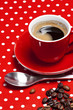 A red cup of coffee on red background