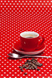 A red cup of coffee on red background