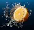 Lemon in water splash on blue background