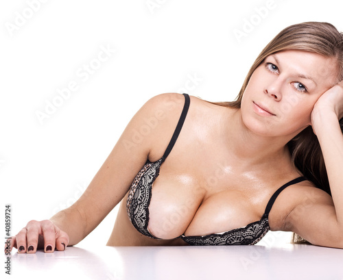 sexy busty woman in black lingerie holding her big wet breast