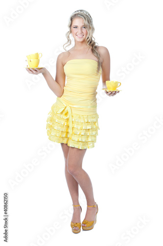 Photo: Young happy woman with yellow cups over white Young happy woman with yellow cups over white
