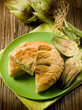 vegetarian quiche with artichoke on wood background vegetarian quiche with artichoke on wood background