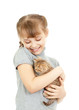Girl hugging with British kitten isolated on white
