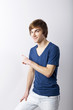 Pointing to a white wall