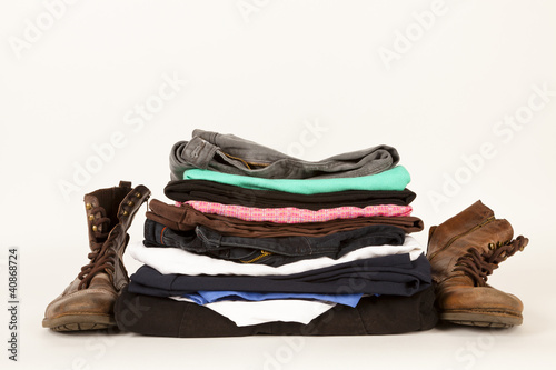 Photo: Old Clothes And A Pair Of Boots For Charity Or Jumble Sale Old Clothes And A Pair Of Boots For Charity Or Jumble Sale