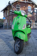 Motor scooter on background of old dutch building Motor scooter on background of old dutch building
