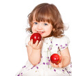 Photo: portrait of a little girl eating apples portrait of a little girl eating apples